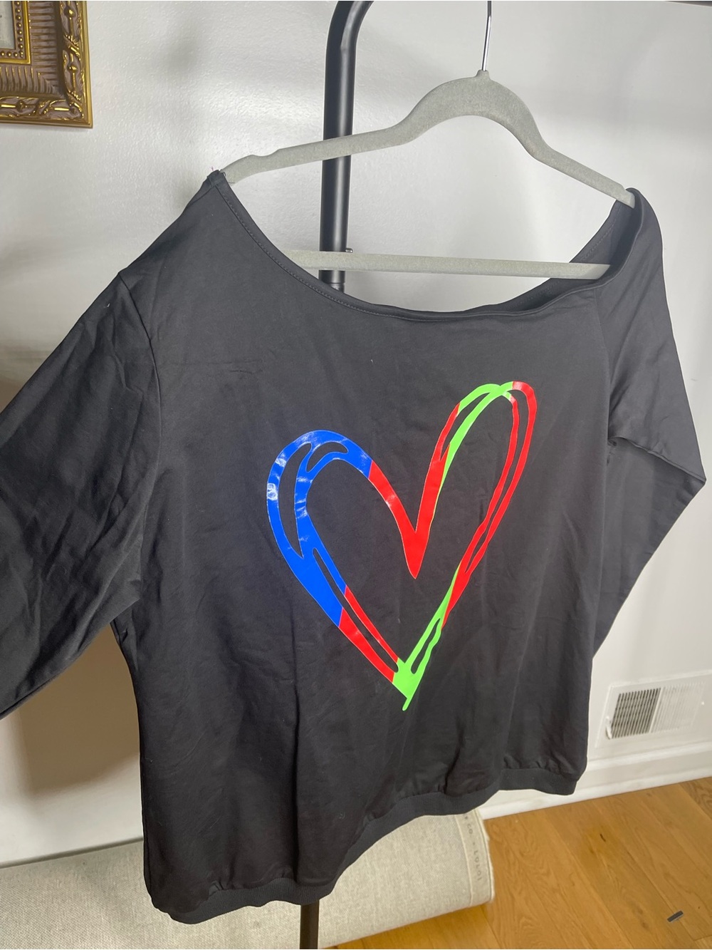Magic Black Off-Shoulder Sweatshirt with Neon Heart Graphic
